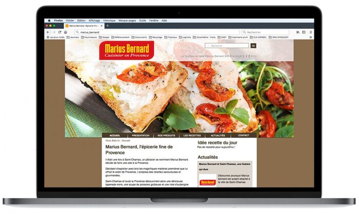 Mockup du site Marius Bernard affiché sur un ordinateur portable Apple