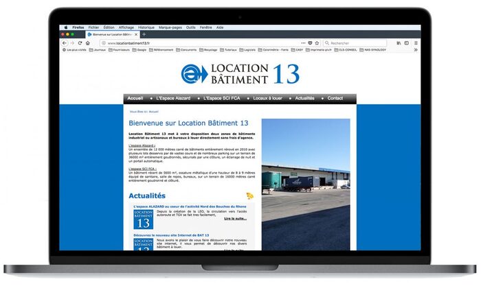 Présentation du site Internet de Location Bâtiment 13 sur un ordinateur portable Apple – création du site professionnel