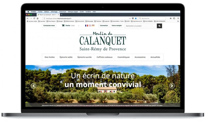 Aperçu de la page d’accueil de la boutique du Moulin du Calanquet dans un visuel d’ordinateur portable – site e-commerce produits provençaux